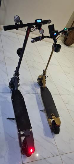 Two scooters on a tile floor

Description automatically generated